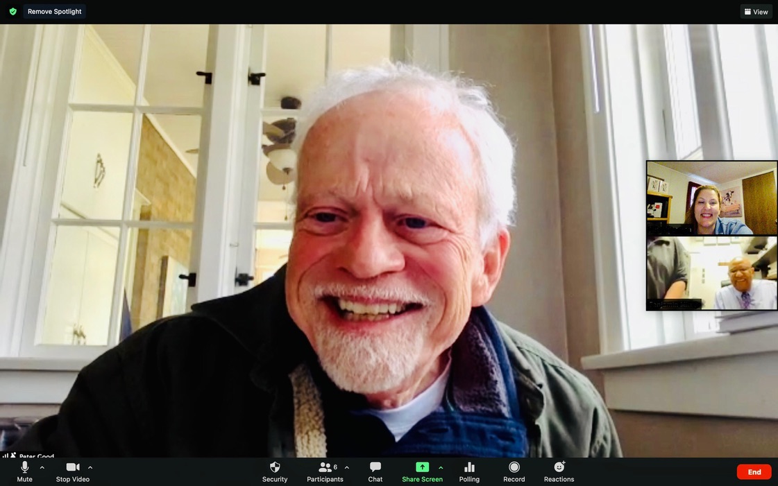 An elder man on a video call with two other people